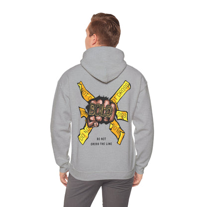 Fashionable grey hoodie featuring a striking bold fist graphic and warning tape design at the back, embodying contemporary streetwear style.