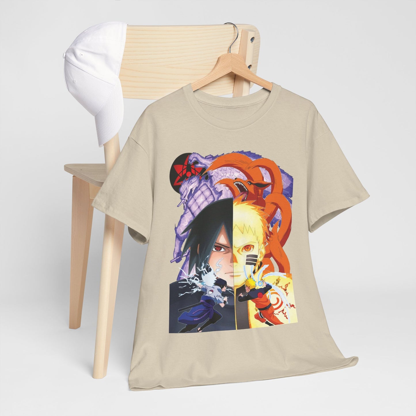 Luxurious anime-inspired t-shirt featuring Sasuke and Naruto, elegantly displayed on a wooden chair with a white baseball cap, showcasing vibrant artistry and dynamic characters.