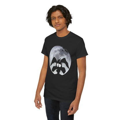 Fashionable young man showcasing a black t-shirt with an artistic depiction of Wile E. Coyote, complementing the moon backdrop, reflecting a blend of fun and high-end style.