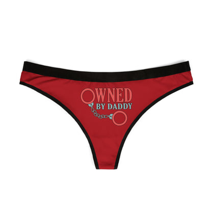 Luxurious red women's thong lingerie featuring the playful text 'OWNED BY DADDY' with graphic handcuff design, adding a touch of cheeky romance.