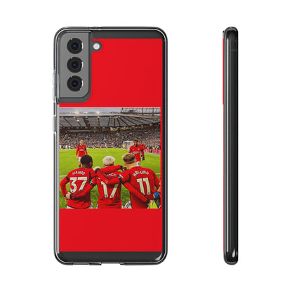 Manchester United Mainoo Garnach Hojlund Soft Phone Case featuring players in red jerseys with a stadium background, perfect for soccer fans and stylish protection.