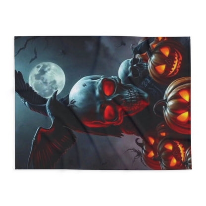 Artistic view of the Decorative and Warm Halloween Spooky Arctic Fleece Blanket laid flat, displaying an intricate design with a skull and pumpkins against a moonlit background.