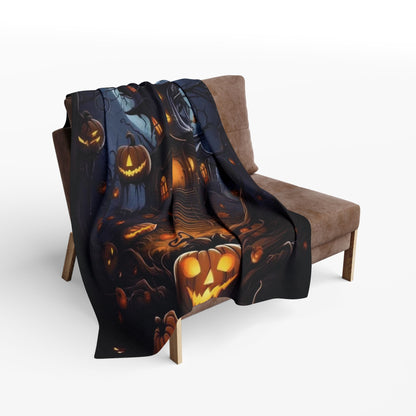 Decorative and Warm Halloween Spooky Arctic Fleece Blanket draped over a stylish chair, displaying its vibrant Halloween-themed design with glowing jack-o'-lanterns.