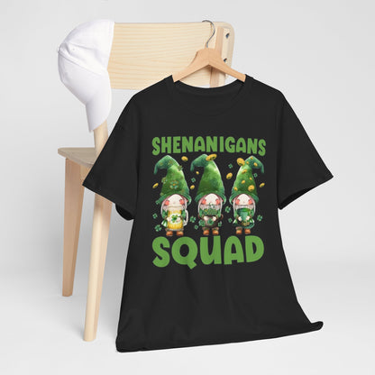 Shenanigans Squad St. Patrick's Day T-Shirt elegantly draped over a wooden chair with a cap, featuring playful leprechauns, a statement piece for festive occasions.