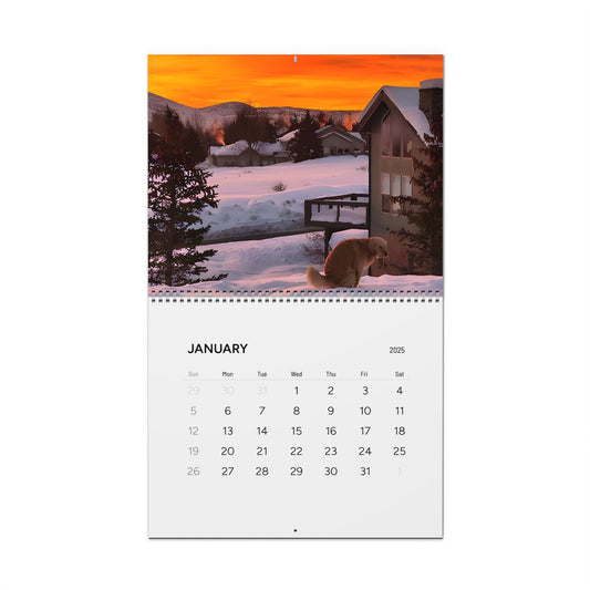 Luxurious January page of the 2025 Dogs Pooping in Beautiful Places Wall Calendar, featuring a picturesque snowy scene with a golden retriever against a dramatic sunset backdrop.