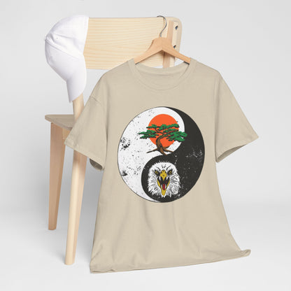 Sophisticated t-shirt draped on a chair, embellished with a unique yin-yang design that captures the spirit of martial arts, combining elegance and power in a single piece.