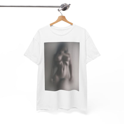 Stylish white graphic t-shirt elegantly hung, presenting an enchanting soft-focus image of a nude silhouette, ideal for the discerning fashion enthusiast.