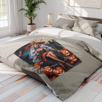 Stylish Decorative and Warm Halloween Spooky Arctic Fleece Blanket laid over a bed, displaying a captivating image of a witch with pumpkins, perfect for enhancing your Halloween festivities.