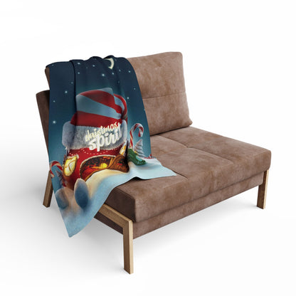 Decorative and Warm Christmas Arctic Fleece Blanket draped elegantly over a stylish couch, featuring festive imagery that enhances the holiday spirit in your home decor.