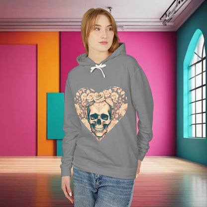 A fashionable woman in a grey Unisex Lightweight Hooded Sweatshirt adorned with a striking skull and roses design, set in a bold interior.