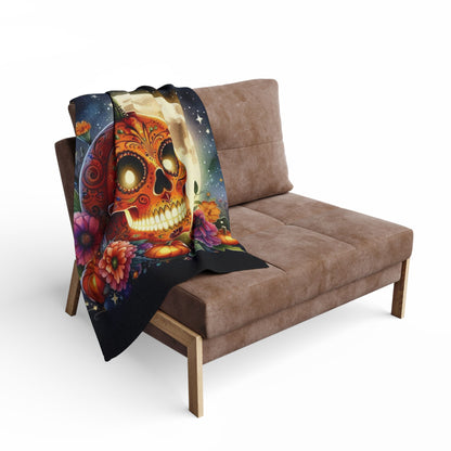 Stylish Decorative and Warm Halloween Spooky Arctic Fleece Blanket draped over a plush sofa, highlighting an exquisite skull pumpkin illustration that enhances the festive atmosphere of your living space.