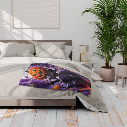Stylish Decorative and Warm Halloween Spooky Arctic Fleece Blanket beautifully arranged on a contemporary bed, highlighting a striking Halloween-themed illustration with a witch and pumpkins.