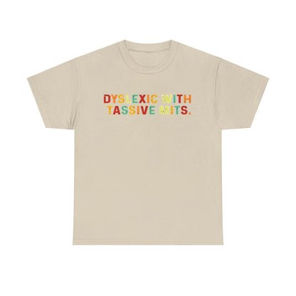 Luxurious unisex cotton tee featuring the phrase 'DYSLEXIC WITH TASSIVE MITS' in vibrant, playful colours against a soft beige background.