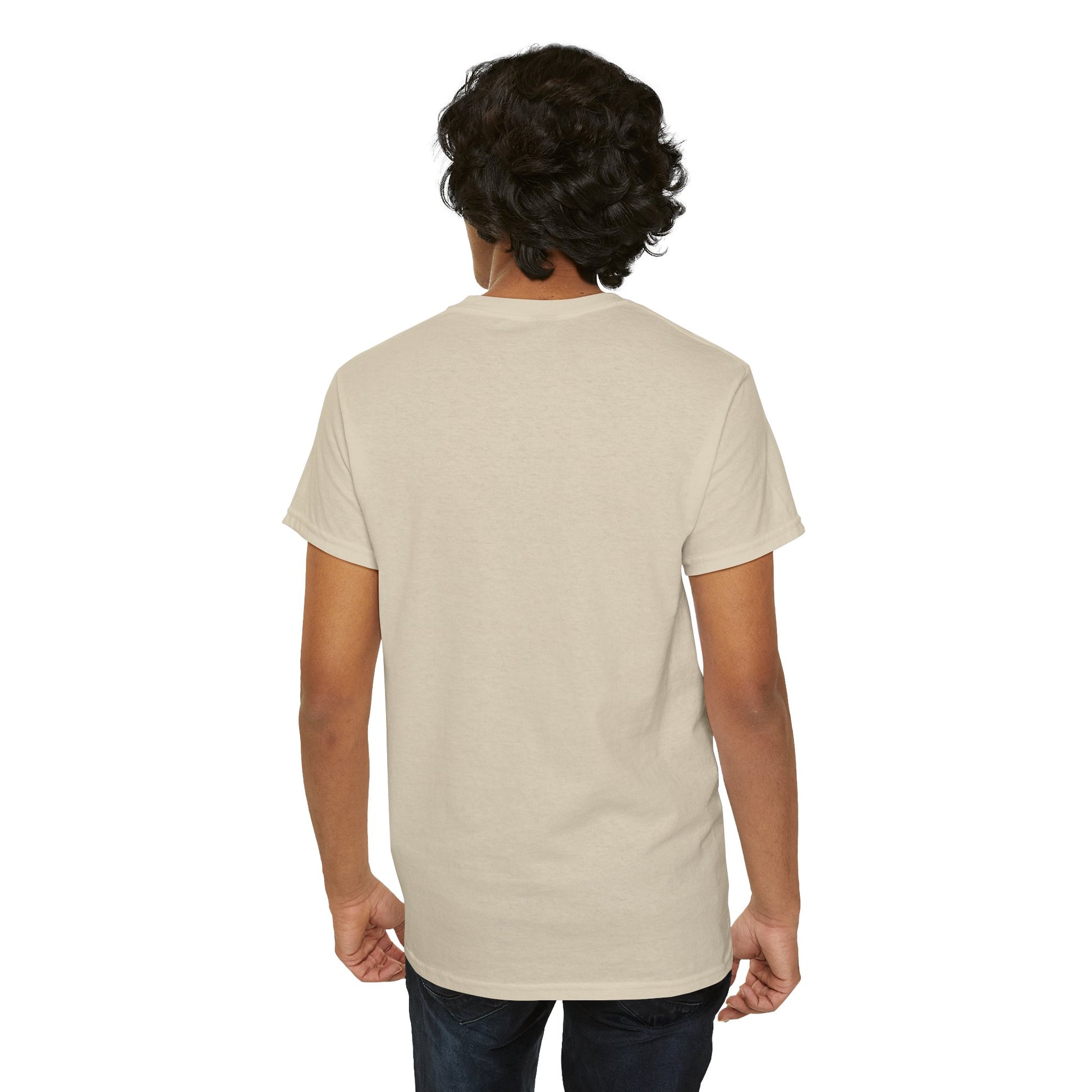Rear view of a fashionable male model wearing a beige T-shirt with a vibrant One Piece design, showcasing the premium fabric and tailored fit, against a clean background.