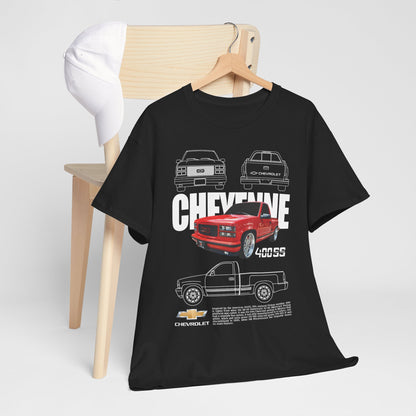 Sophisticated presentation of the Chevrolet Cheyenne T-Shirt draped over a wooden chair, paired with a stylish cap, showcasing the iconic red 400SS truck design.