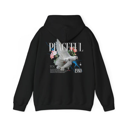 Elegant black hoodie adorned with a striking dove and floral design, showcasing the text 'PEACEFUL 1980', perfect for a luxurious casual look.
