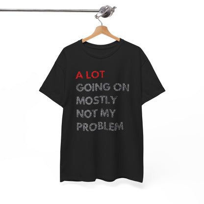 Refined black t-shirt on a hanger highlighting the playful slogan 'A LOT GOING ON MOSTLY NOT MY PROBLEM', a statement of relaxed luxury.