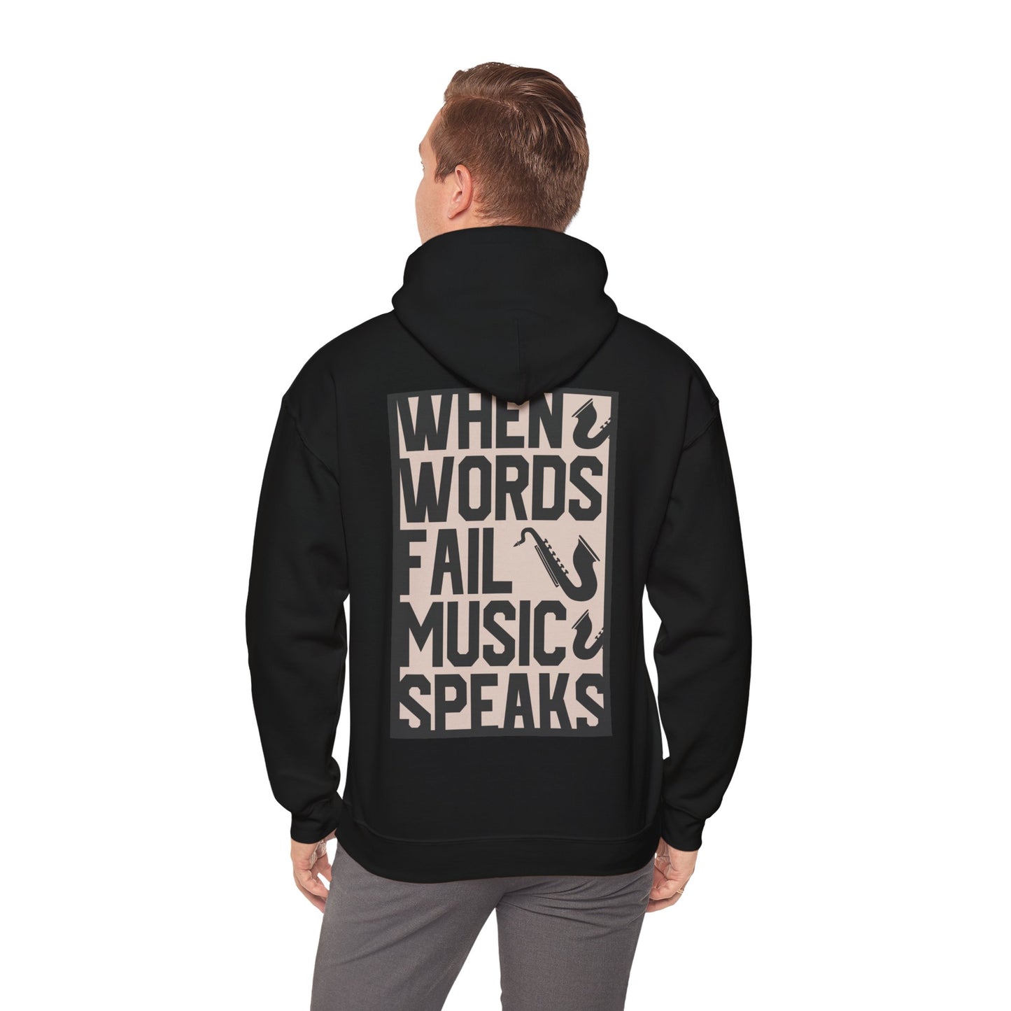 Refined back view of a black hoodie displaying the impactful message 'WHEN WORDS FAIL MUSIC SPEAKS' with saxophone graphics, suitable for music aficionados.