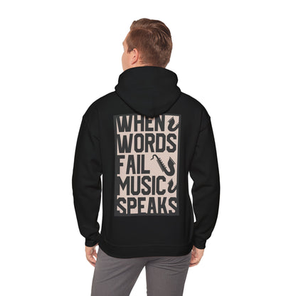 Refined back view of a black hoodie displaying the impactful message 'WHEN WORDS FAIL MUSIC SPEAKS' with saxophone graphics, suitable for music aficionados.