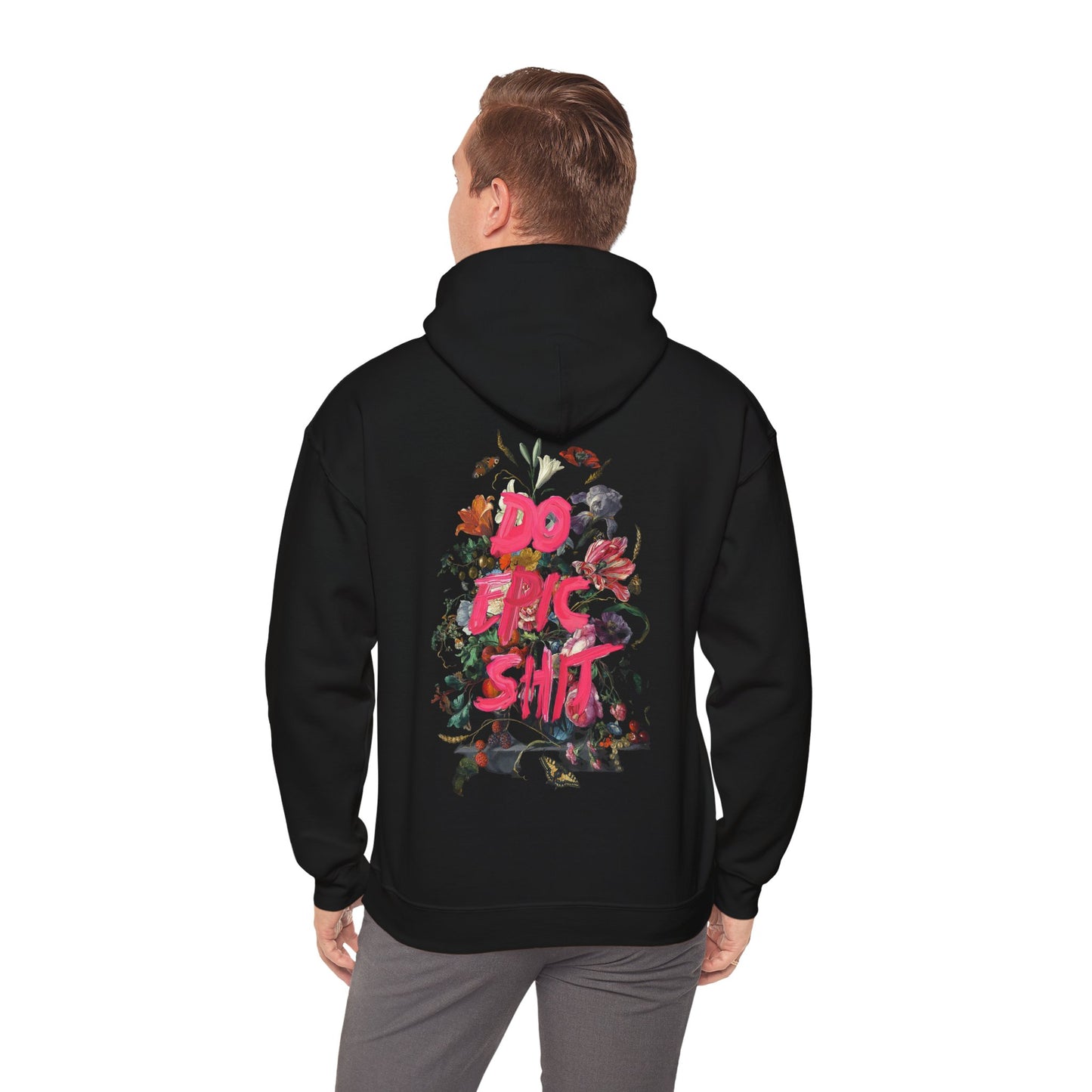 Stylish black hoodie worn by a model, highlighting the colourful floral graphic and empowering message on the back.
