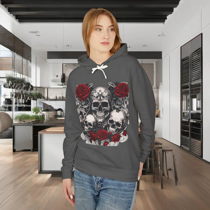 Model showcasing a grey Unisex Lightweight Hooded Sweatshirt adorned with a unique designer skull and roses, set in a modern luxury kitchen.