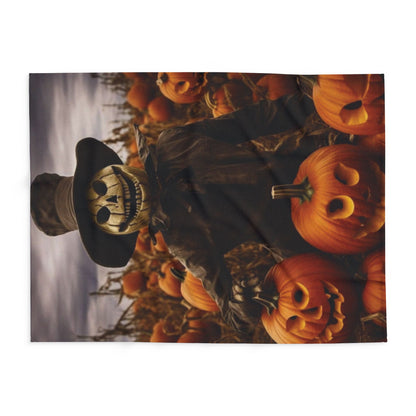 Charming Decorative and Warm Halloween Spooky Arctic Fleece Blanket showcasing a haunting scarecrow amidst a pumpkin patch, ideal for adding a touch of seasonal elegance to any decor.