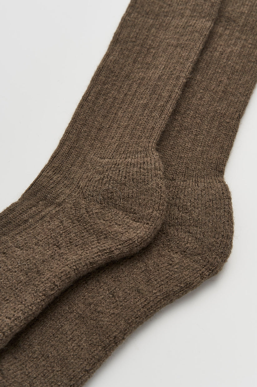 Close-up of premium wool knee high socks with cushioned soles, designed for ultimate comfort and warmth, perfect for chilly days.