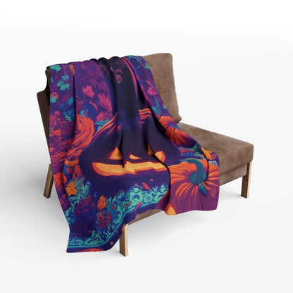 Decorative and Warm Halloween Spooky Arctic Fleece Blanket elegantly displayed on a chair, featuring a captivating design with pumpkins and a black cat, perfect for enhancing your home’s Halloween ambience.