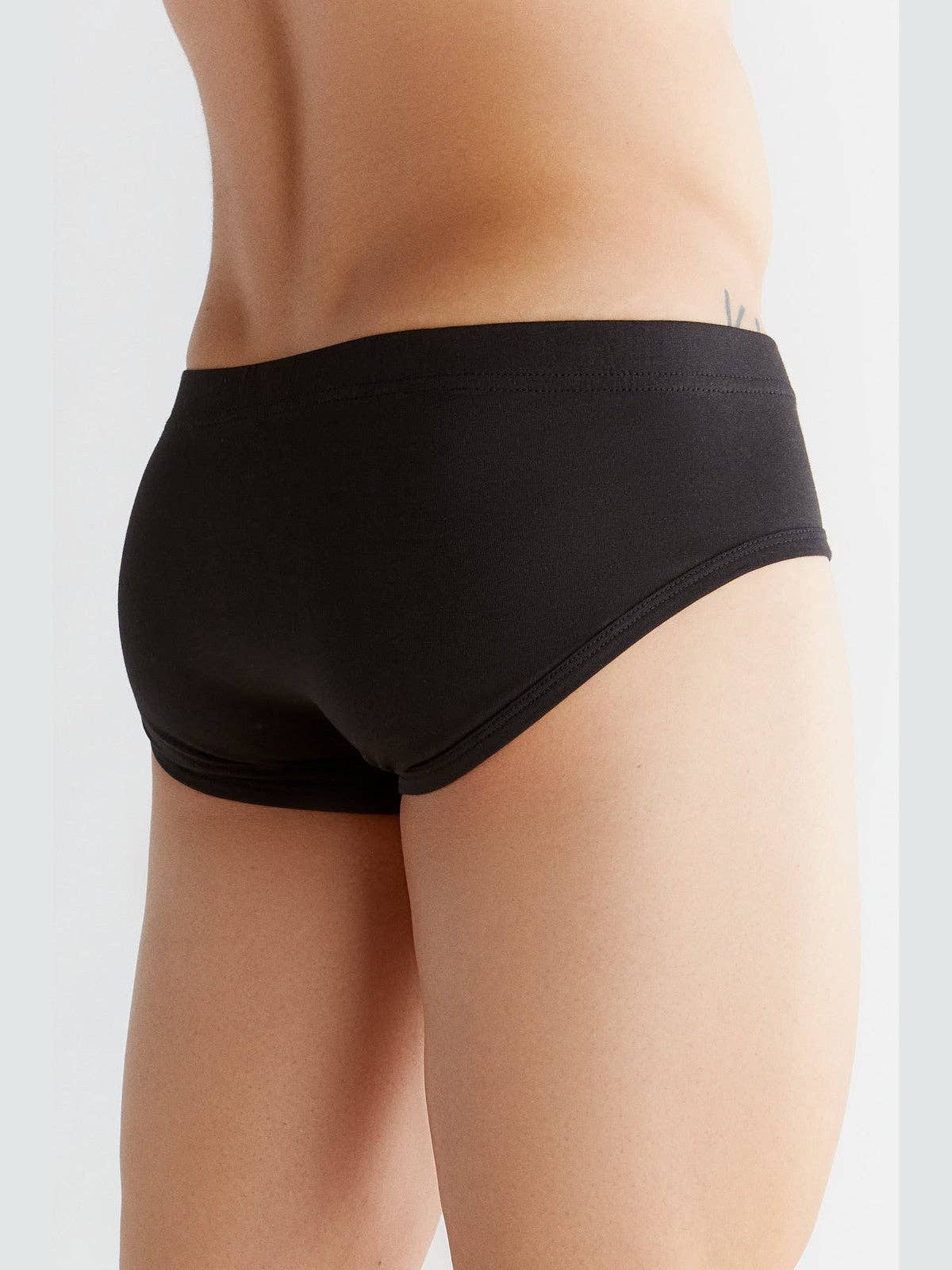Luxury organic cotton briefs for men featuring a soft elastic waistband, embodying eco-friendly comfort and style.