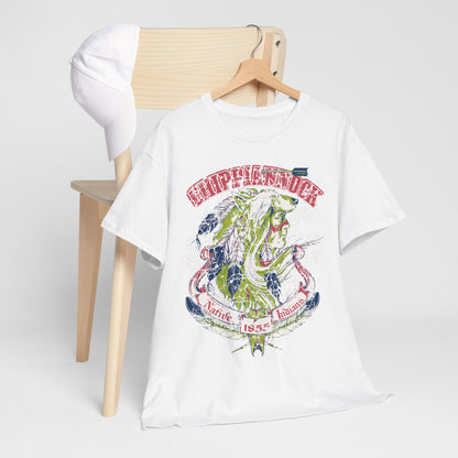 Chic portrayal of a Native American Heritage Graphic T-Shirt with compelling Wolf Headdress design, elegantly positioned on a wooden hanger alongside a stylish cap, illustrating a fashionable fusion of culture and style.