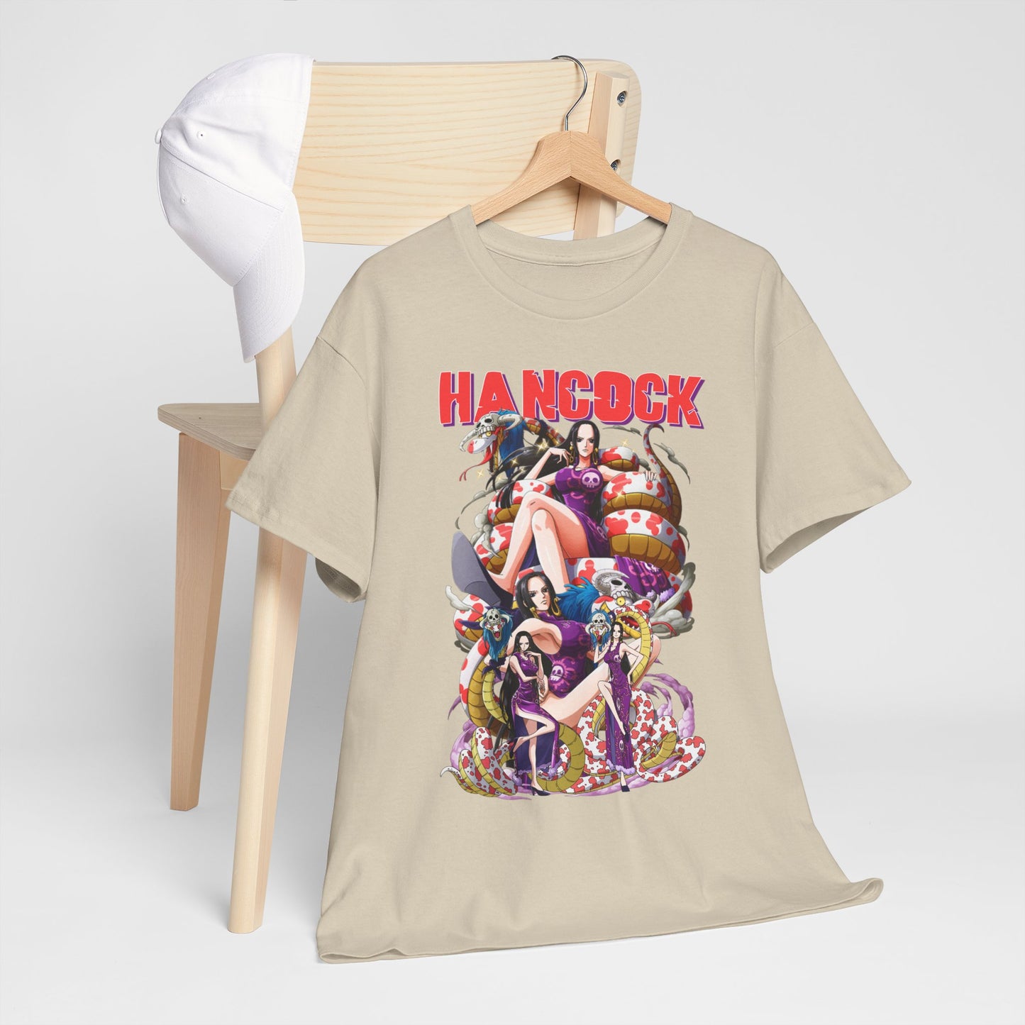Stylish Hancock anime-themed men's t-shirt displayed on a wooden hanger, complemented by a white cap, exuding a trendy and casual vibe.