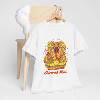 Sophisticated Cobra Kai t-shirt laid nicely on a wooden chair alongside a white cap, showcasing a vibrant yellow snake motif, ideal for fashionable casual attire.