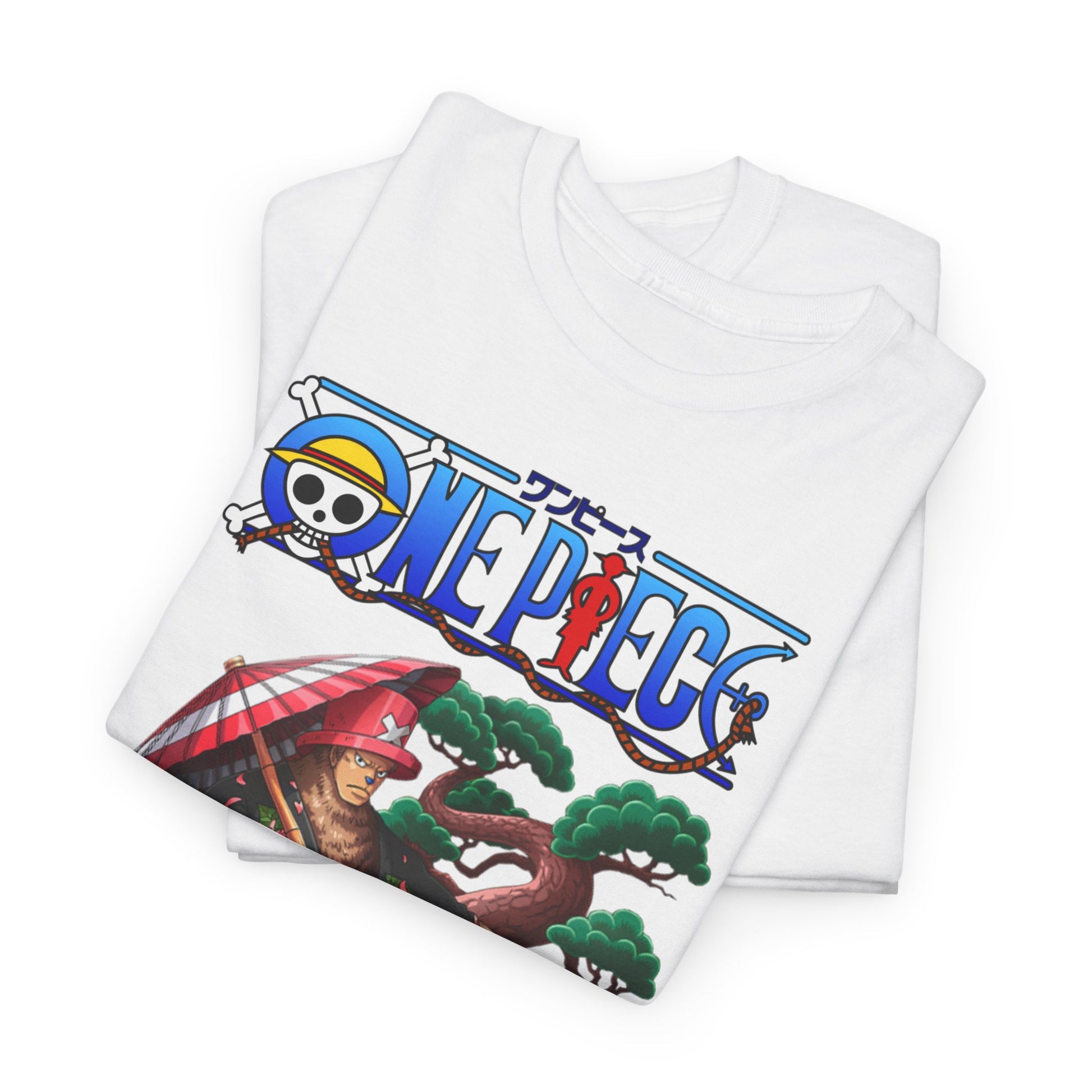 A neatly folded white t-shirt emblazoned with Chopper from One Piece, set against an artistic backdrop of lush greenery and a colourful logo, ideal for anime enthusiasts.