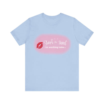 Sabrina Carpenter Inspired Unisex Short Sleeve Tee in light blue featuring an eye-catching lipstick graphic and the line 'Short n sweet, I'm working late...', ideal for stylish comfort.