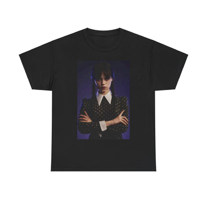 High-quality unisex graphic tee featuring the title 'Wednesday: Embrace the Dark Elegance!' with an image of a character in a black dress and white collar, embodying gothic sophistication, perfect for fans of the series.