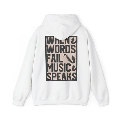 Luxury white hoodie featuring bold music-inspired typography on the back, showcasing the phrase 'WHEN WORDS FAIL MUSIC SPEAKS' along with elegant saxophone illustrations, perfect for music lovers.