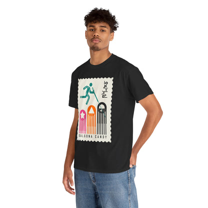 Chic black tee worn by a model, featuring an eye-catching graphic inspired by 'Squid Game', epitomising contemporary casual elegance.