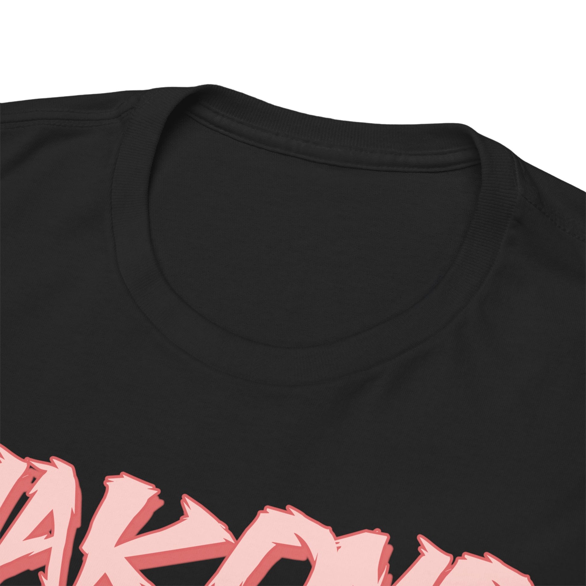 Close-up view of the neckline of a luxury black Makomo anime T-shirt, showcasing the premium fabric and vivid print of the character's name.