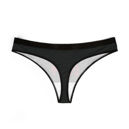 Chic black thong with soft fabric, displaying the eye-catching 'SLIPPERY WHEN WET' design in vibrant pink, ideal for adding a touch of daring style to your lingerie collection.