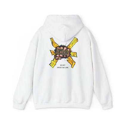 Luxury white hoodie featuring a striking back print of a clenched fist holding a diamond-encrusted ring, emblazoned with the word 'BOLD' and surrounded by vibrant yellow banners stating 'DO NOT CROSS THE LINE'.