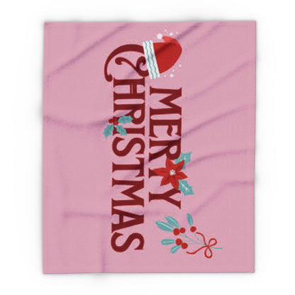 Decorative and Warm Christmas Arctic Fleece Blanket showcasing a whimsical 'Merry Christmas' design adorned with a Santa hat and seasonal decorations in a charming pink hue.