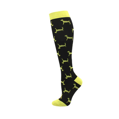 Trendy Women's Knee Length Compression Travel Socks showcasing playful black fabric with luminous yellow dog silhouettes, perfect for comfort, style, and circulation.