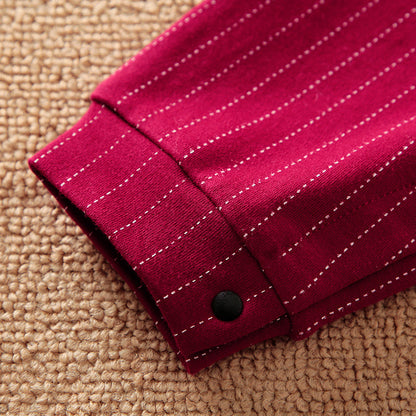 Close-up view of the luxurious wine red fabric of the Gentleman Baby Boy Jumpsuit, showcasing delicate pinstripe detailing, perfect for stylish infants.