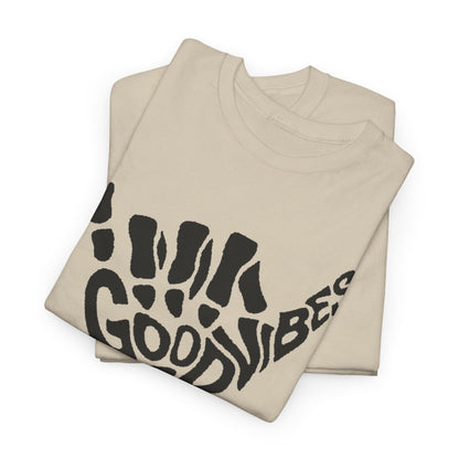 Folded cream t-shirts showcasing the striking skeletal hand gesture design and 'Good Vibes' text, perfect for those who appreciate unique, eye-catching apparel.