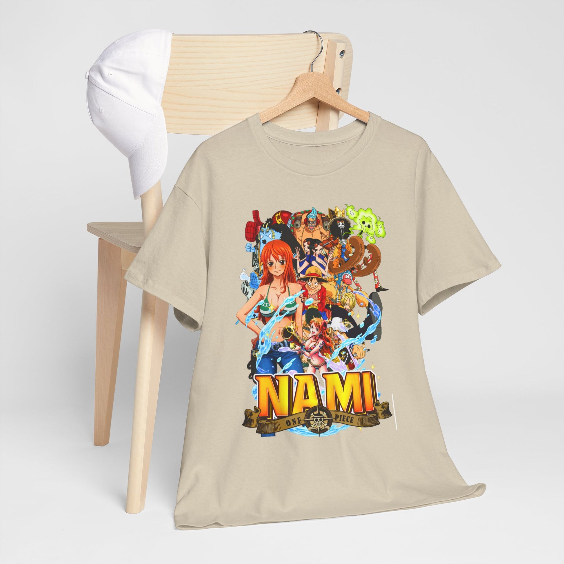 Artfully styled men's Nami graphic t-shirt from One Piece resting on a wooden chair, complemented by a chic white cap, perfect for casual elegance.