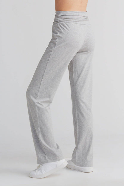 Close-up of premium organic cotton leggings, highlighting the soft jersey texture and wide cuffed waistband.