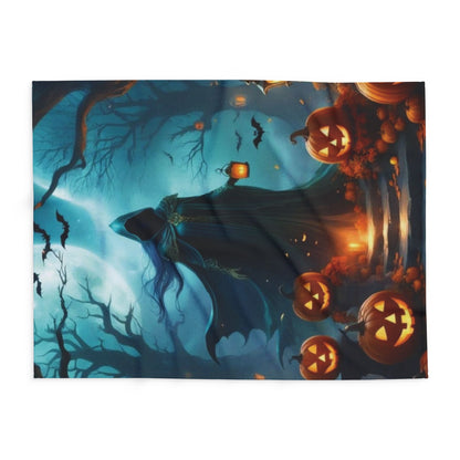 Luxurious Decorative and Warm Halloween Spooky Arctic Fleece Blanket featuring a mystical figure among glowing jack-o'-lanterns under a moonlit sky.