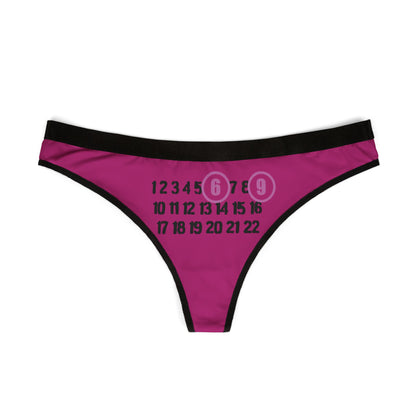 Elegant Cheeky 69 Thong displayed flat, showcasing its provocative design with playful numbers in a chic colour palette of pinkish-purple and black.