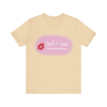 Sabrina Carpenter Inspired Unisex Short Sleeve Tee in a soft beige shade with a striking lipstick print, embodying a sense of style and luxury.