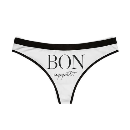 Stylish thong displaying 'BON appétit' in sophisticated font, adorned with refined black borders, ideal for playful yet luxurious lingerie collections.
